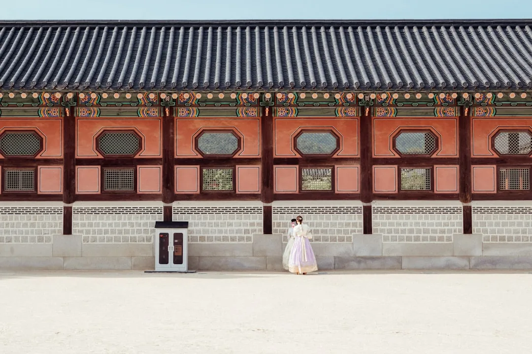 Women in traditional hanbok at a Joseon royal palace, evoking Empress Myeongseong's court