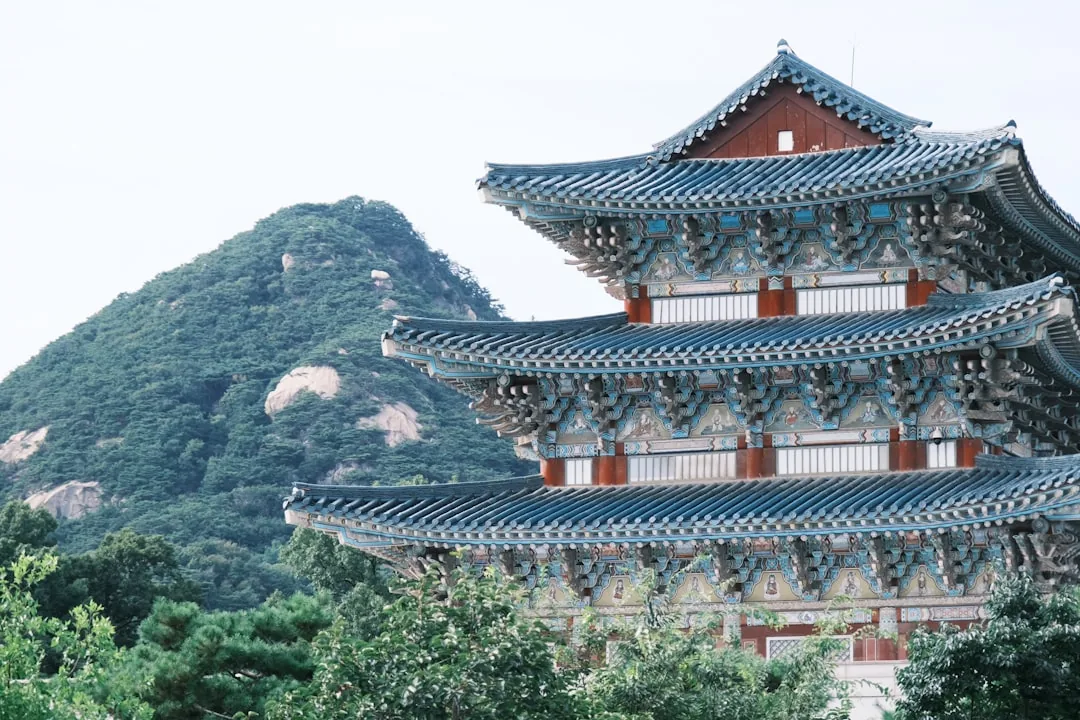 A Korean Buddhist temple surrounded by green trees, home to the Naneun Jeolo retreat