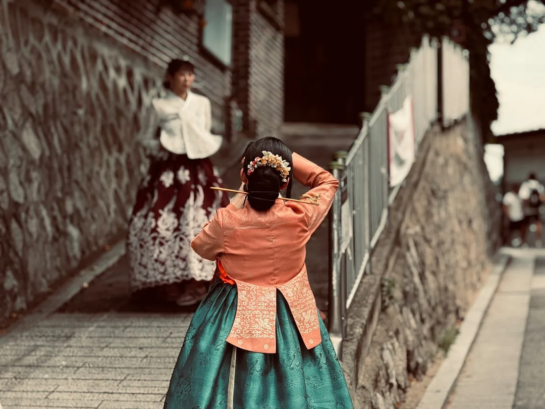Two women in modern hanbok-inspired jackets, part of Korea's granola-chic gorpcore style