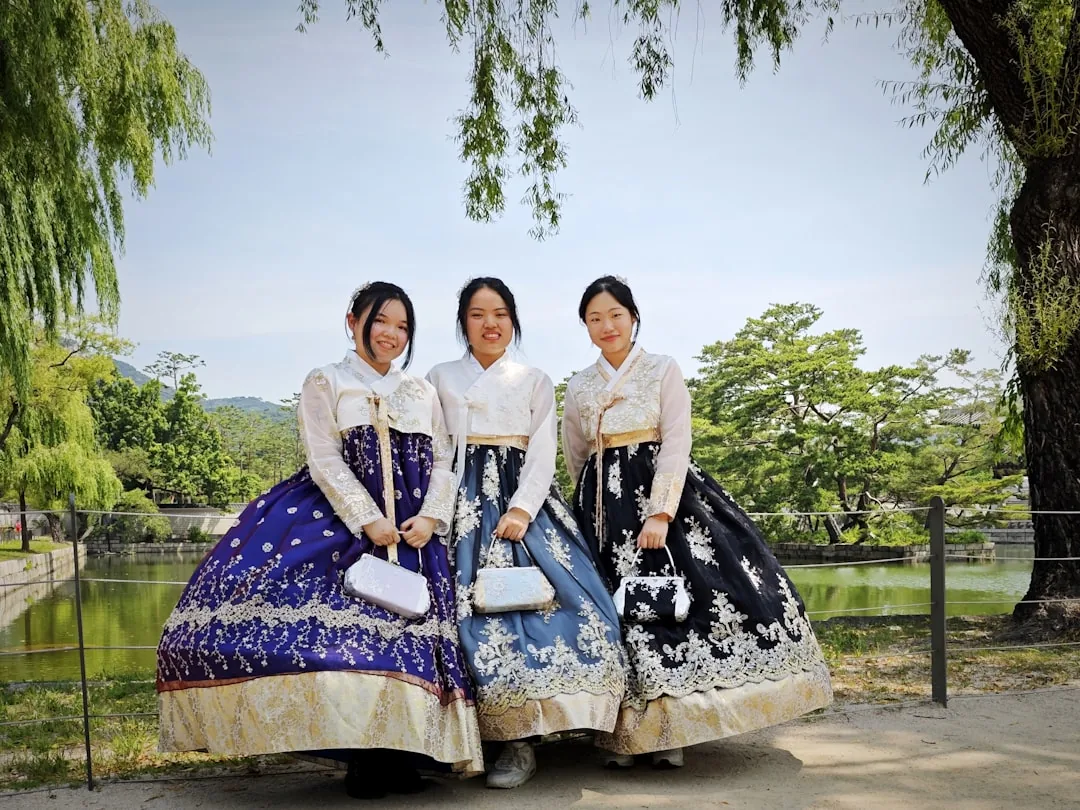 Three women in hanbok-inspired outfits showing Seongsu-dong's granola-chic street style