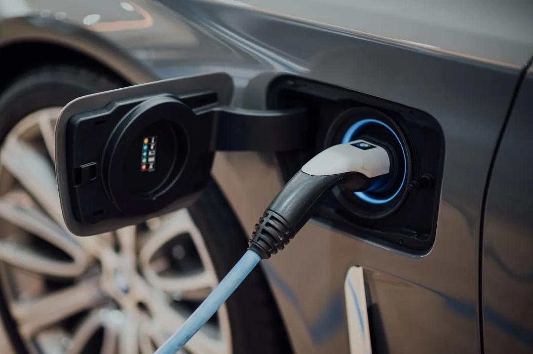 Electric vehicle charging cable plugged into a car's port
