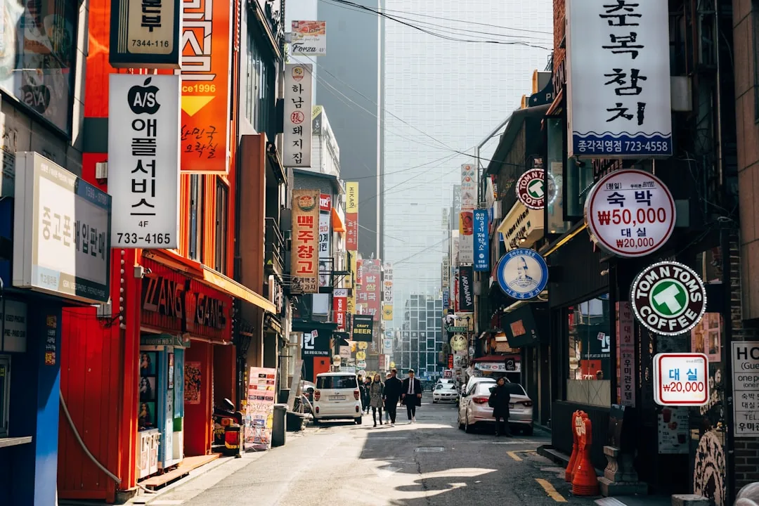 Shoppers walking past Myeongdong's flagship stores in Seoul