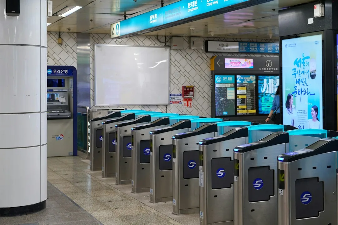 Automated turnstile fare gates at a Seoul subway station entrance
